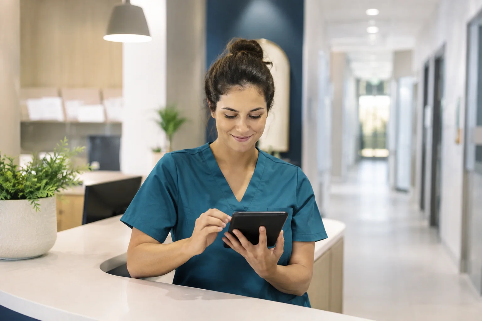 Clinic coordinator organizing patient communications on a tablet